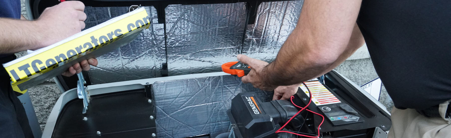 An LT Generators technician testing an open Generac generator with a clamp meter, clipboard in hand.