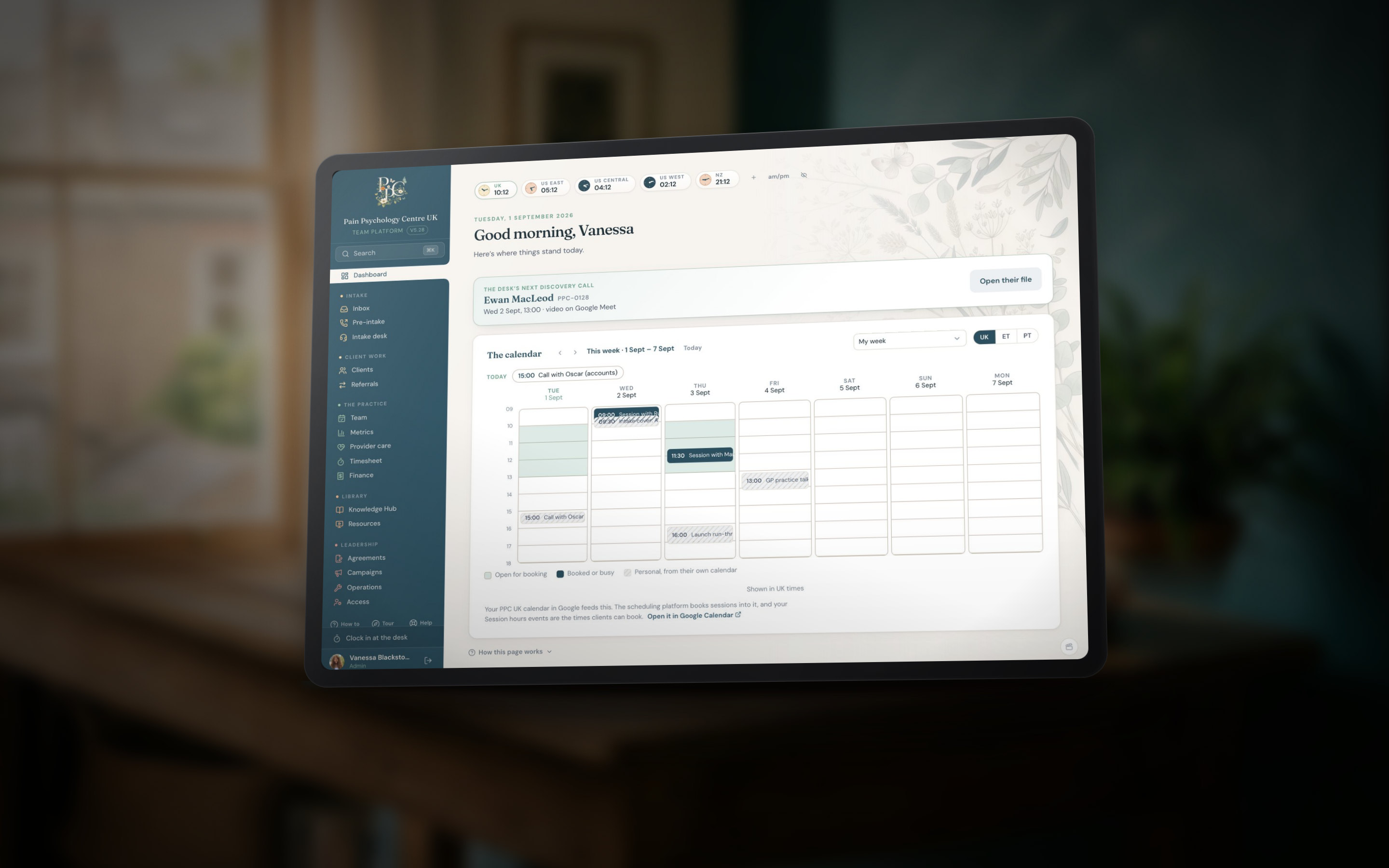 The PPCUK dashboard on a tablet, on the wooden desk in the London room
