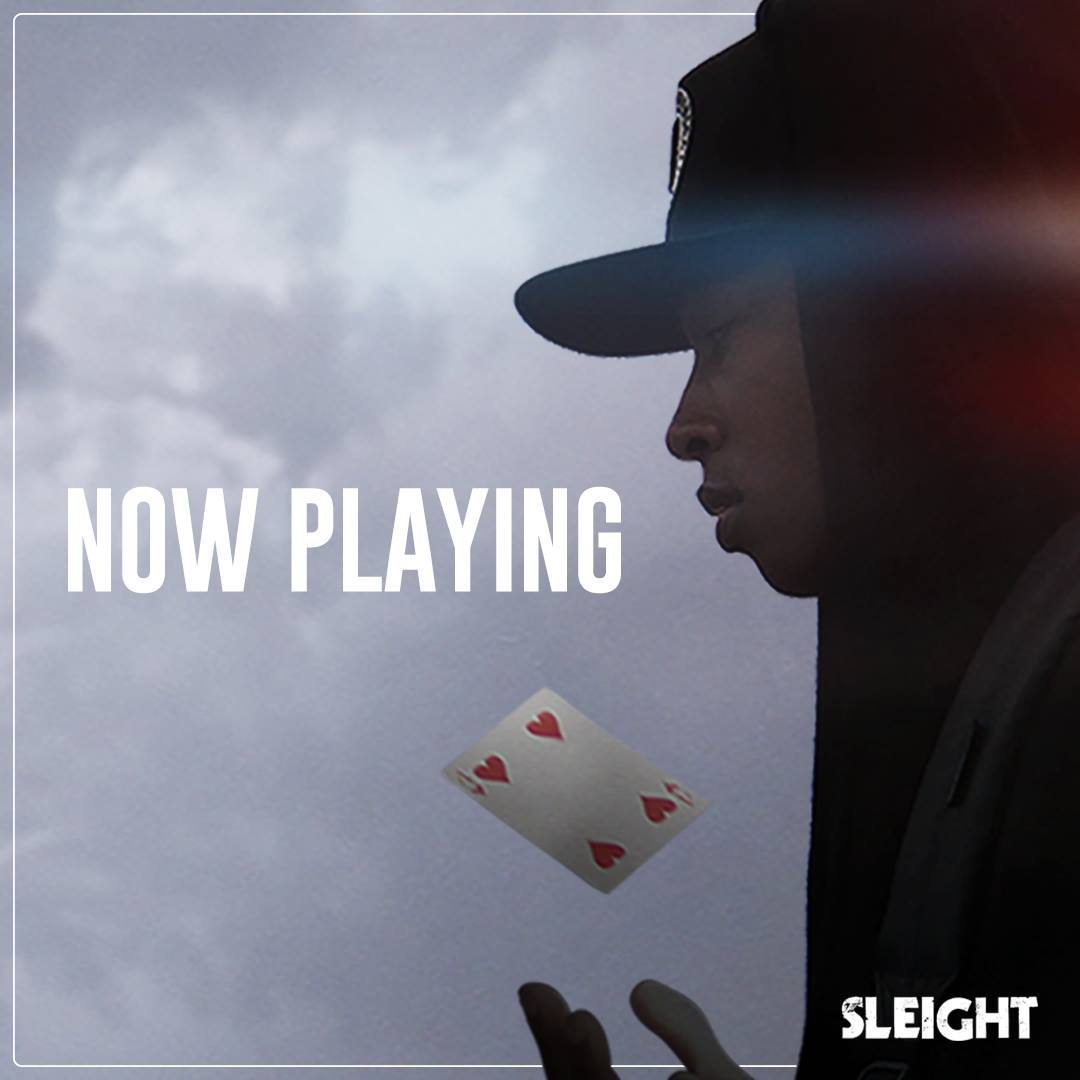 Now Playing, with a falling playing card
