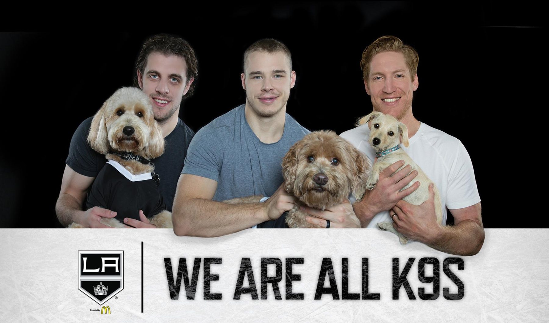 Three players holding their dogs over the words We Are All K9s