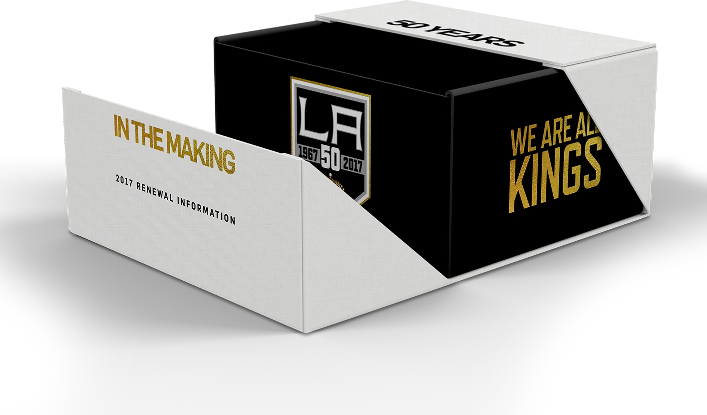 A white mailer box opening to a black box with the 50th crest