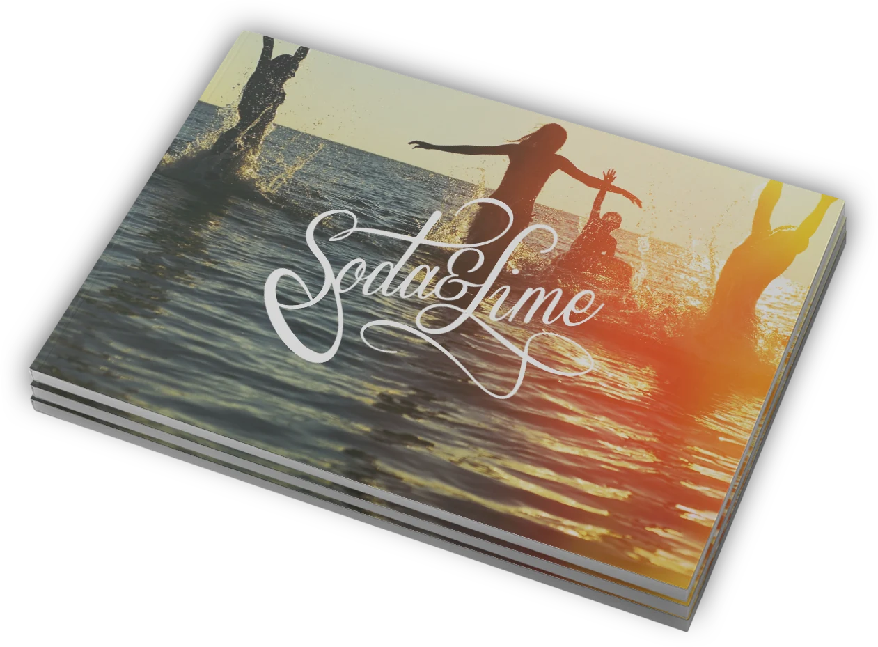 A stack of printed pitch books with the script mark on a sunset cover